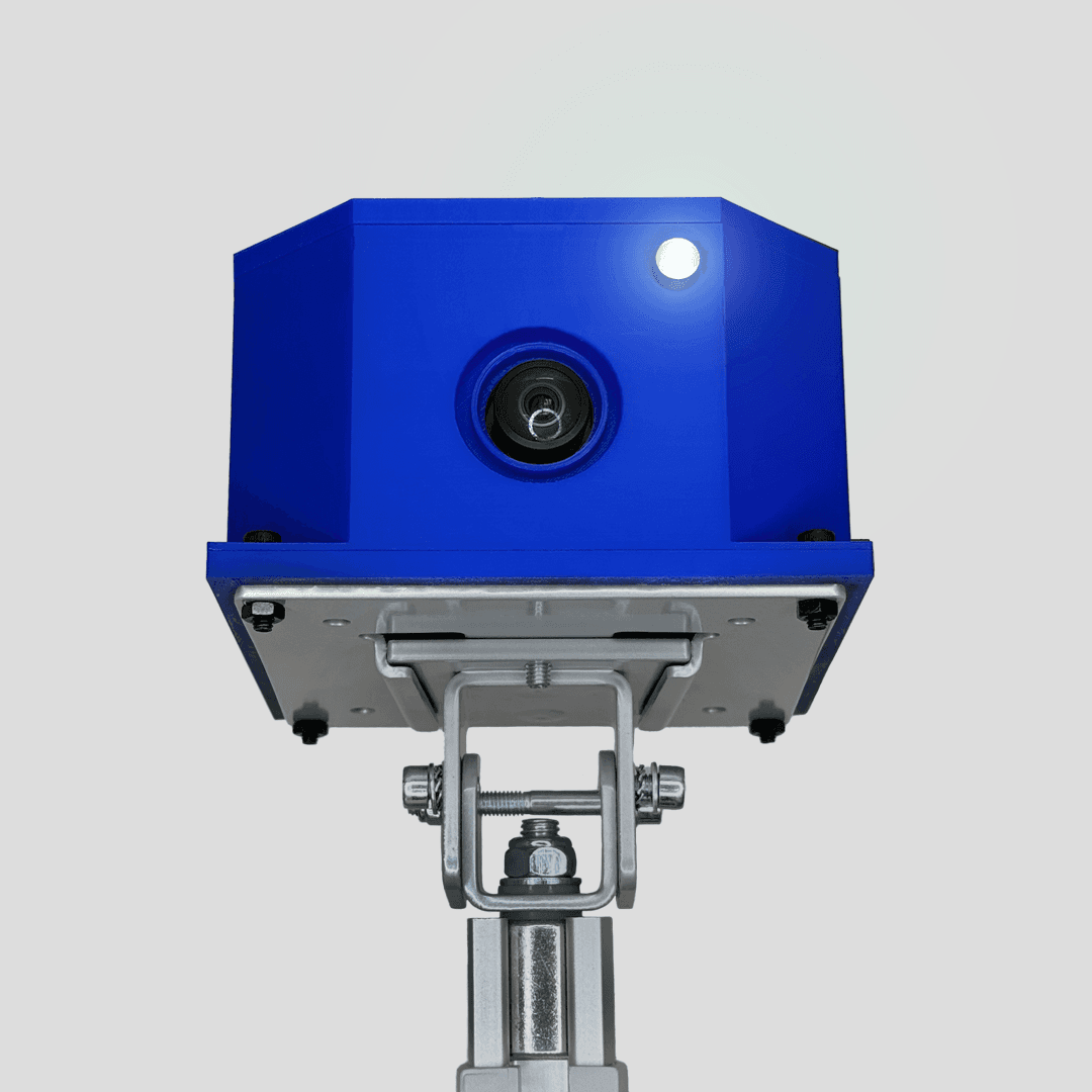 Front view of a blue ClipPack camera with a lit indicator and mounting bracket