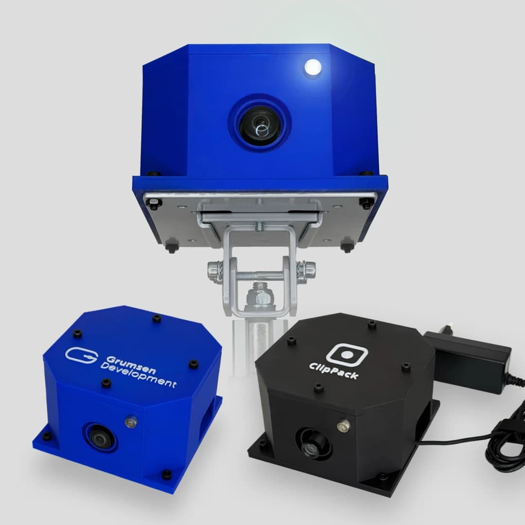 Blue and black ClipPack housings and a camera on an adjustable mounting bracket